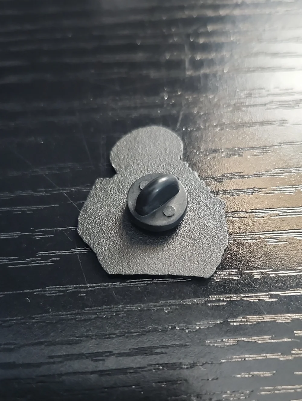 Black & White Skeleton Holding Cat Enamel Pin